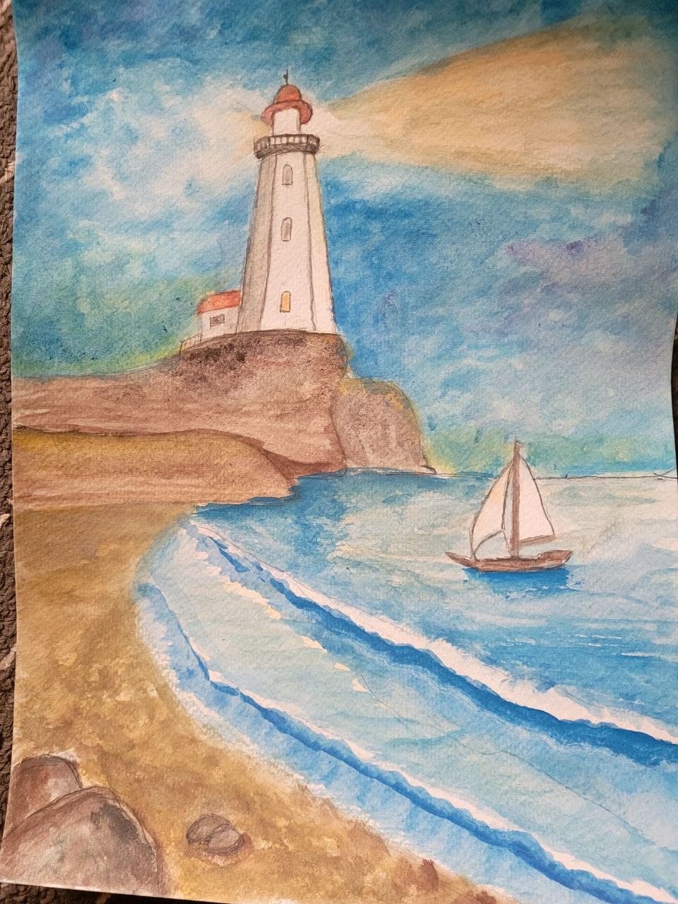 Watercolor painting of a lighthouse on a cliff overlooking a sailboat on the blue sea.